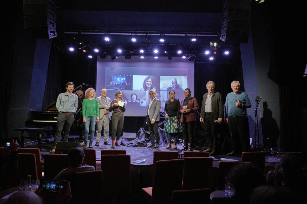Group Picture with Award winners, Dr. Ernst Fürlinger, Dr. Norbert Mayr, Dr. Payal Parekh, Dr. Brototi Roy, Dr. Michael Staudinger,  Dr. Mariam A. Wagialla, Mag. Heinz Wittenbrink, and the musicians Karin Österreicher and Simon Raab