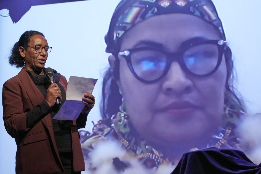 Dr. Mariam A. Wagialla, Advisory Board Member, announcing the winner Olivia Bisa Tirko